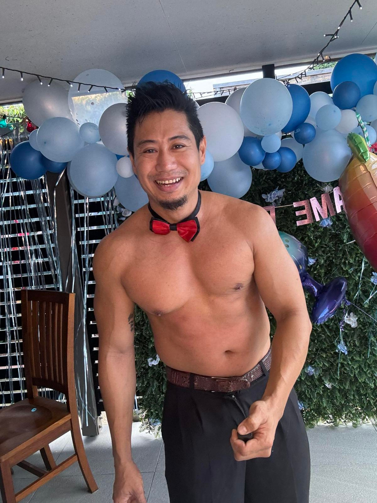 Olly Cairns topless waiter