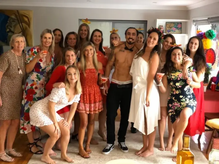 Yuri posing with ladies at hens party